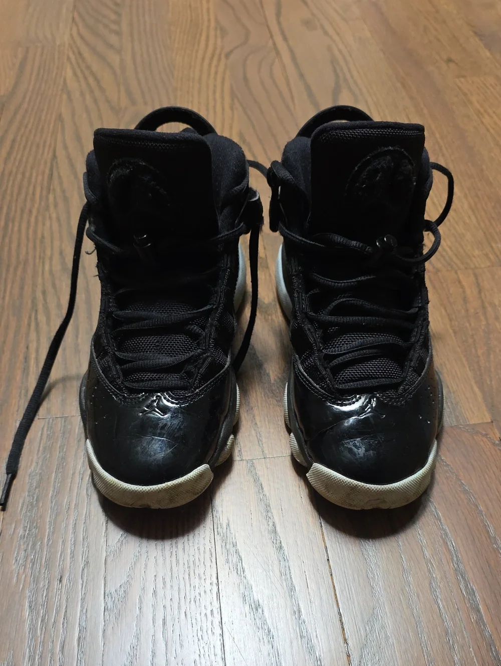 Jordan Black High-Top Patent Leather Sneakers